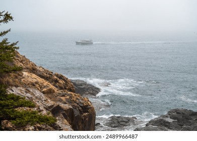 Boat Sailing Through Fog Near Rocky Coastline A small boat sails through a thick fog on a calm sea, near a rocky coastline. The fog is so dense that the boat appears to be floating in the air, and th - Powered by Shutterstock