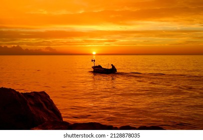 Boat at sea at sunset. Sunset boat on water - Powered by Shutterstock