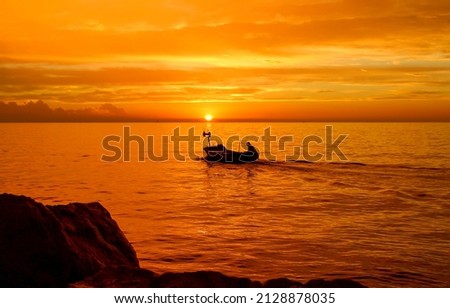 Boat at sea at sunset. Sunset boat on water
