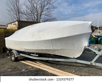 Boat shrink wrap waits on trailer