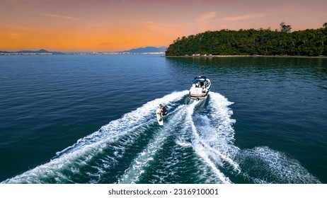 Boat Speedboat Yacht Sea Wakeboard Travel Summer Tourism Vacations Outdoors Activities Nautical Sports Wake Island Sport Florianopolis Floripa Atlantic Ocean Lagoon Water Tropical Rainforest Drone SC - Powered by Shutterstock