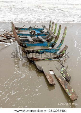 The boat, sunk long ago, was driven to the beach by the surf.