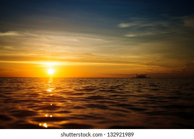 Boat and sunset - Powered by Shutterstock