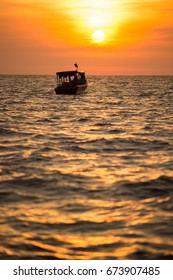 a boat in the sunset