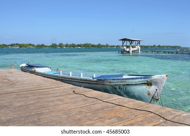 Boat Tied To Pier; Utila, Bay Islands, Honduras