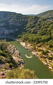 The Boat With Tourists Does A Sharp Turn On The River In Provence