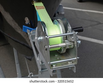 Boat Trailer Winch With Blue Rope On Shore