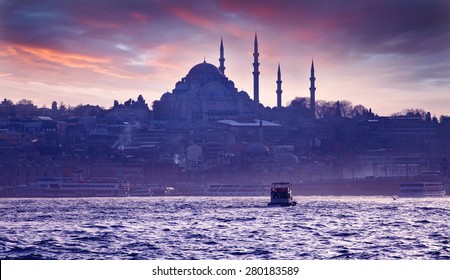 A boat trip on the Bosphorus at sunset. Istanbul at sunset. Evening Istanbul. Tourist trip in Turkey.