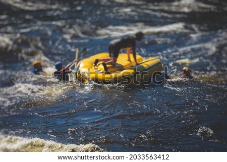 Boat is turned upside down during rafting extreme water sports with man drowning, concept of fail and solving problems, team work and survival, boat accident during kayaking and canoeing on the river