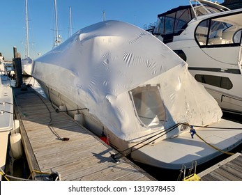 Boat Waits For Summer With Shrink Wrap Cover