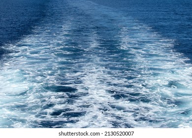 Boat Wake In Blue Ocean. 