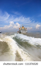 Boat Wake And Cargo Ship To The Sea