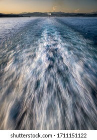 Boat Wake Followed By A Cruise.