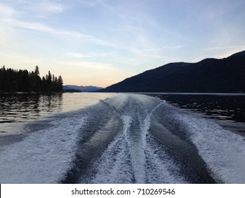 Boat Wake On Lake After Sunset