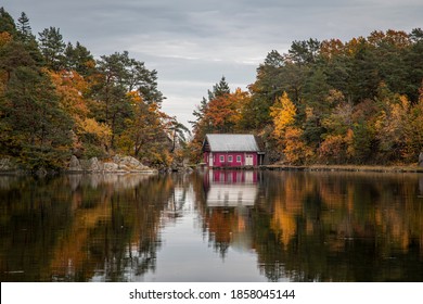 Boathouse next to a lake on an overcast autumn afternoon
