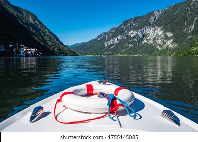 Boating on Lake Hallstatt with an Electric Motor Boat in a Beautiful Alpine Landscape, the Prow or Bow of a Rental Boat