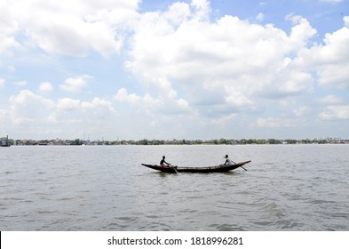 Boatmen Row Boat At River Ganges During Autumn Season On September 16,2020 In Calcutta, India.