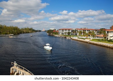 Boats Approach The Intracoastal Waterway Bridge Just North Of Hillsboro Blvd. In Deerfield Beach, Florida In A Bright Sunny Afternoon With The Boca Raton Hotel And Resort In The Background