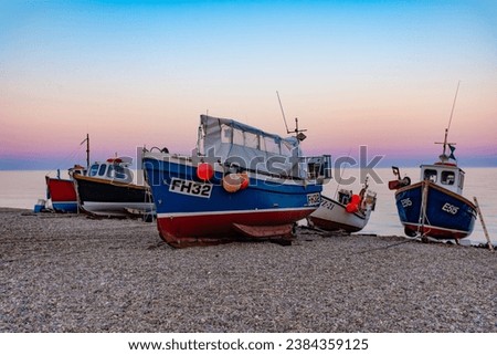 The boats of Beer beach at sunset
