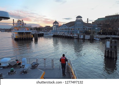 Boats, City Skyline And Waterfront Of Alexandria, Virginia Viewed From The Water At Sunset