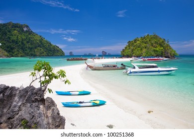 boats and the clear sea Phi Phi south of Thailand