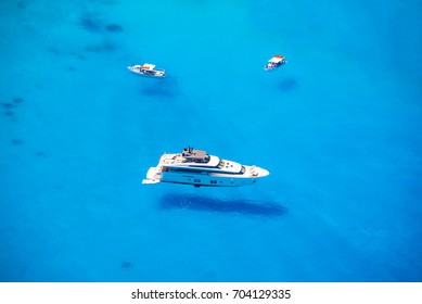 Boats in crystal clear sea water, Greece