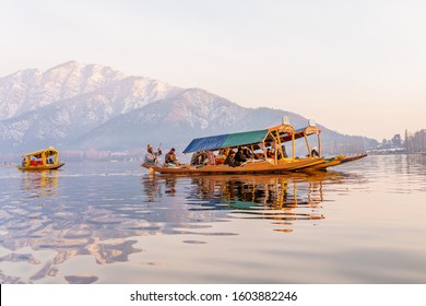 The boats in Dal lake near the center of Srinagar during winter after sunset  , Srinagar , Kashmir , India -  January 14 , 2019 