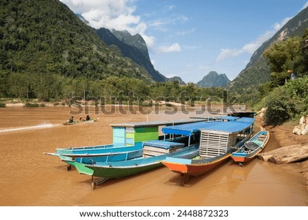 Boats docked on the Nam Ou River at Muang Ngoi Neua looking north, Luang Prabang Province, Northern Laos, Laos, Indochina, Southeast Asia, Asia