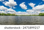 Boats floats on the Moskva River past the Zhivopisny Bridge and other famous places timelapse hyperlapse, Russia. View from motor boat at sunny summer day with cloudy sky