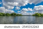 Boats floats on the Moskva River past the Zhivopisny Bridge and other famous places timelapse hyperlapse, Russia. View from motor boat at sunny summer day with cloudy sky