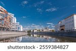 Boats floats on the Moskva River past the Moscow Kremlin and other famous places timelapse hyperlapse, Russia. View from motor boat at sunny summer day with cloudy sky