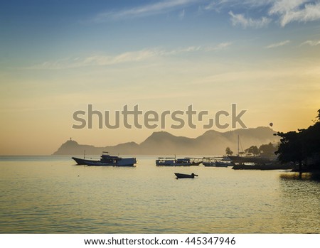 boats at harbour in dili coast east timor at sunset