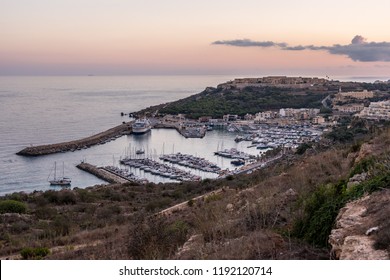 Boats In The Harbour With The Gozo Ferry Mgarr.Horizontal. Above View  September 2018