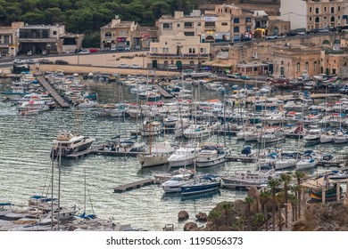 Boats In The Harbour With The Gozo Ferry Mgarr.Horizontal. Above View  September 2018