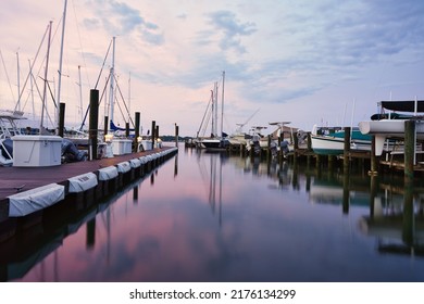 Boats in the marina at sunset. A sky in pastels over Annapolis on the Chesapeake Bay in the state of Maryland, USA.                               