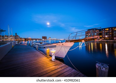 Boats in a marina at twilight, in Fells Point, Baltimore, Maryland.
