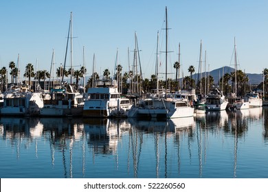 Boats moored in bay at the Chula Vista Bayfront park with mountain peak in the background. - Shutterstock ID 522260560