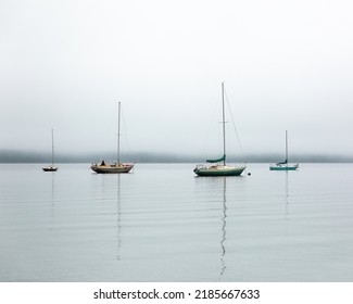 Boats Moored In A Foggy Harbour On Cortes Island BC