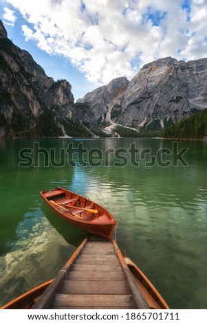 Boats on the Braies Lake ( Pragser Wildsee ) in Dolomites Alps, Sudtirol, Italy