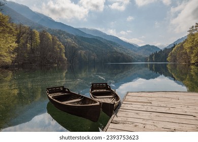 Boats on the clear water of Biogradasko Lake in Biogradaska Gora National Park in Montenegro - Powered by Shutterstock - Get 15% off with code: PIKWIZARD15