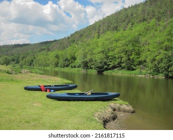 Boats on the grassy beach of the river, sports in nature