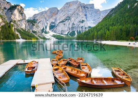 Boats on the Lake Braies in Dolomites mountains, Italy. Picturesque Italian landscape. 