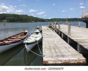 Boats Tied Up Along A Dock On The Mystic River In Connecticut