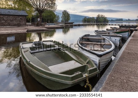 Boats tied to the jetty at Llangorse Lake, Brecon Beacons National Park. Taken just after sunrise.