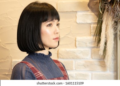 Bob Cut Black Hair Woman.