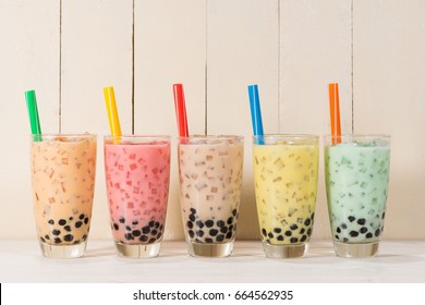 Boba / Bubble tea. Homemade Various Milk Tea with Pearls on wooden table.