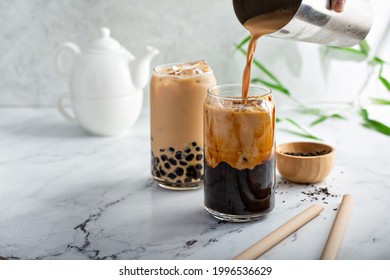 Boba Milk Tea With Brown Sugar Syrup In A Tall Glass With Ice On Marble Table