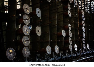 Bobbins stacked up at an abandoned silk mill.