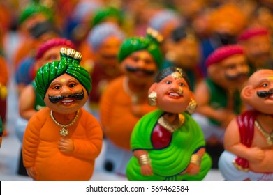 Bobble Heads Of Caricatures Of Indian Men With Moustaches And Turbans And Women In A Saree