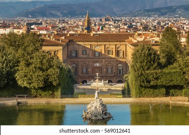 The Boboli Gardens park, Fountain of Neptune and a distant view on The Palazzo Pitti, in English sometimes called the Pitti Palace, in Florence, Italy. Popular tourist attraction and destination.